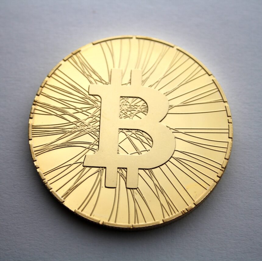 Physical Bitcoin coin — BTC holds near $82,500 ahead of record $11.7B options expiry on October 30