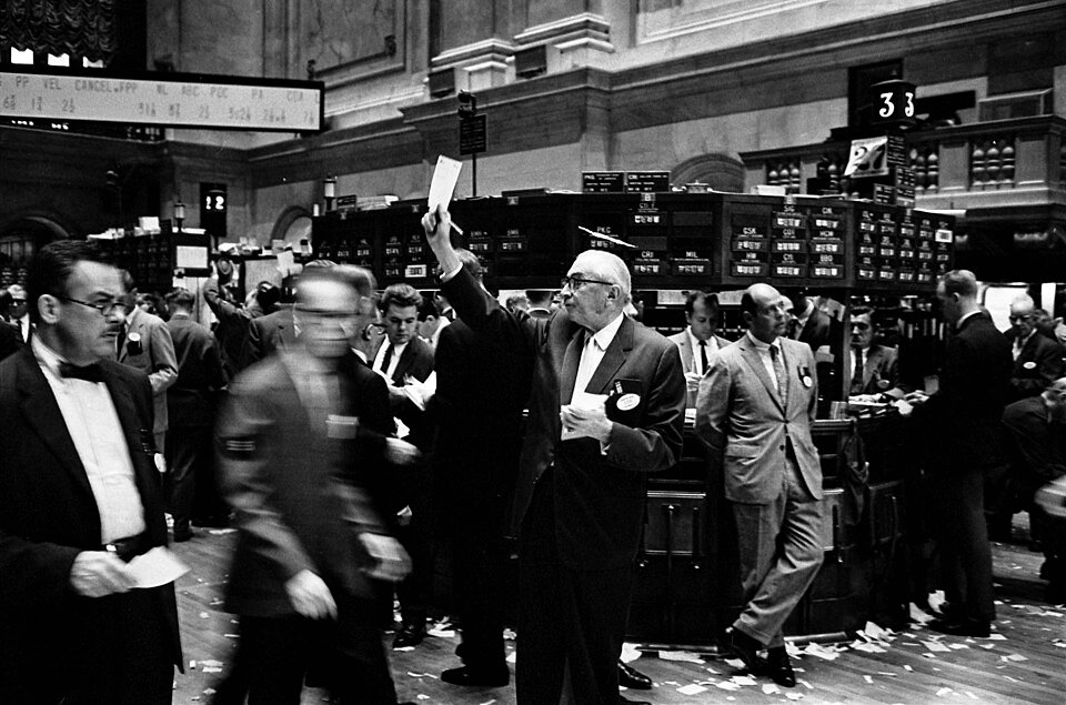 Traders on the New York Stock Exchange floor — bitcoin's $11 billion options expiry settled near max pain while the hack selloff drove liquidations